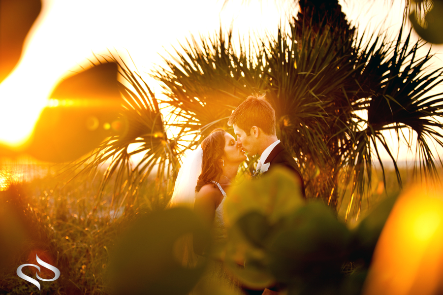 Bride and Groom in beach sunflare