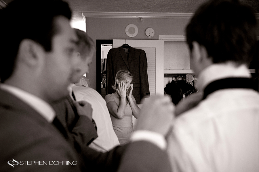 Mom crying while groom gets ready