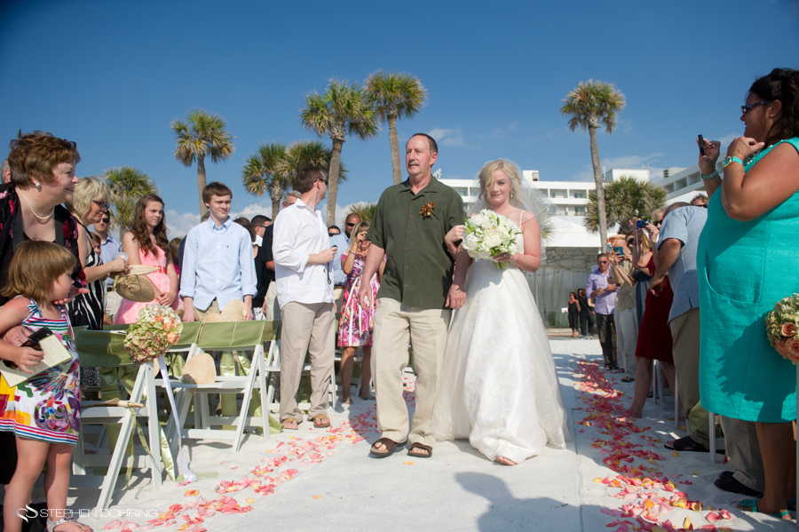 Bride walking down the beach isle at the Clearwater beach Hilton