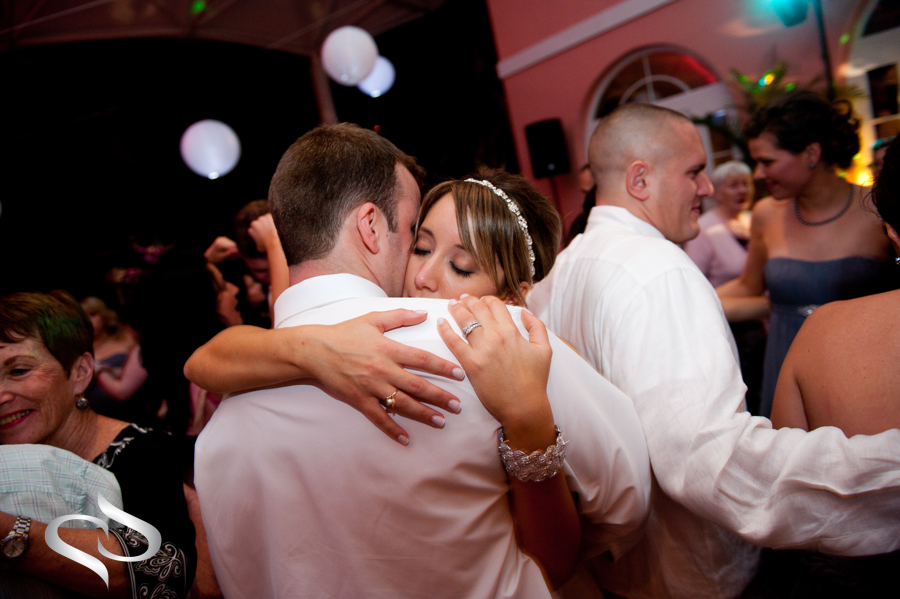 Bride and groom embrace at Don Cesar Wedding