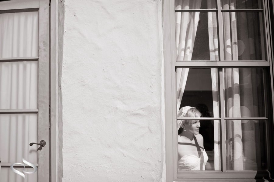 Bride looking out window before wedding at the Vinoy St. Petersburg Penthouse