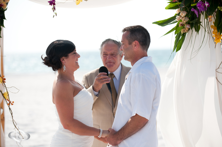 Bride and Groom giving vows on beach