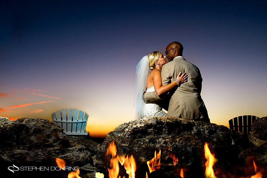 Bride and Groom by beach bonfire