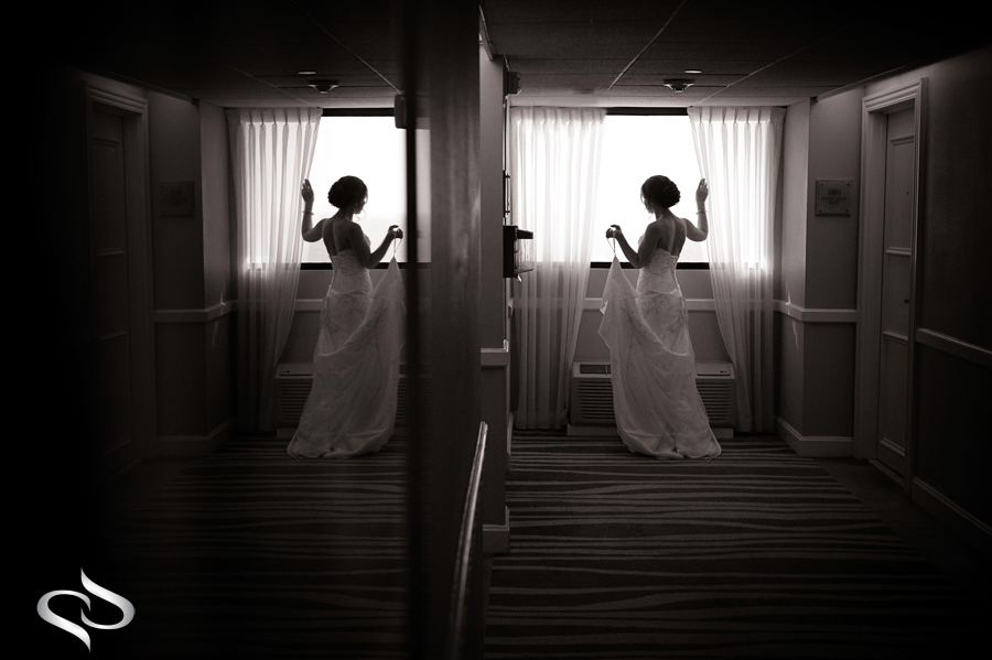Bride Looking out window Clearwater Beach Hilton