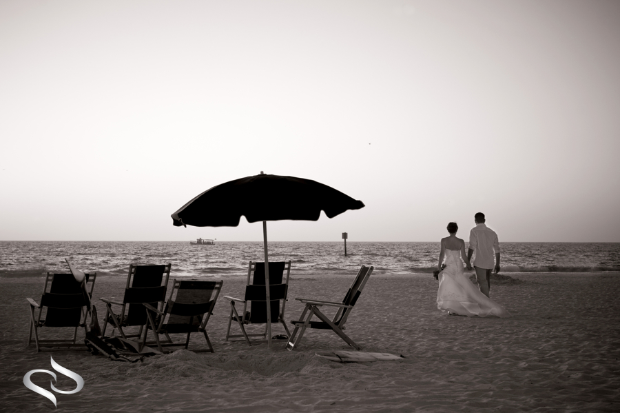 Bride and Groom walking on Clearwater Beach Hilton