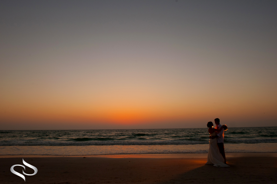 Bride and Groom creative sunset wedding picture Clearwater Beach FL